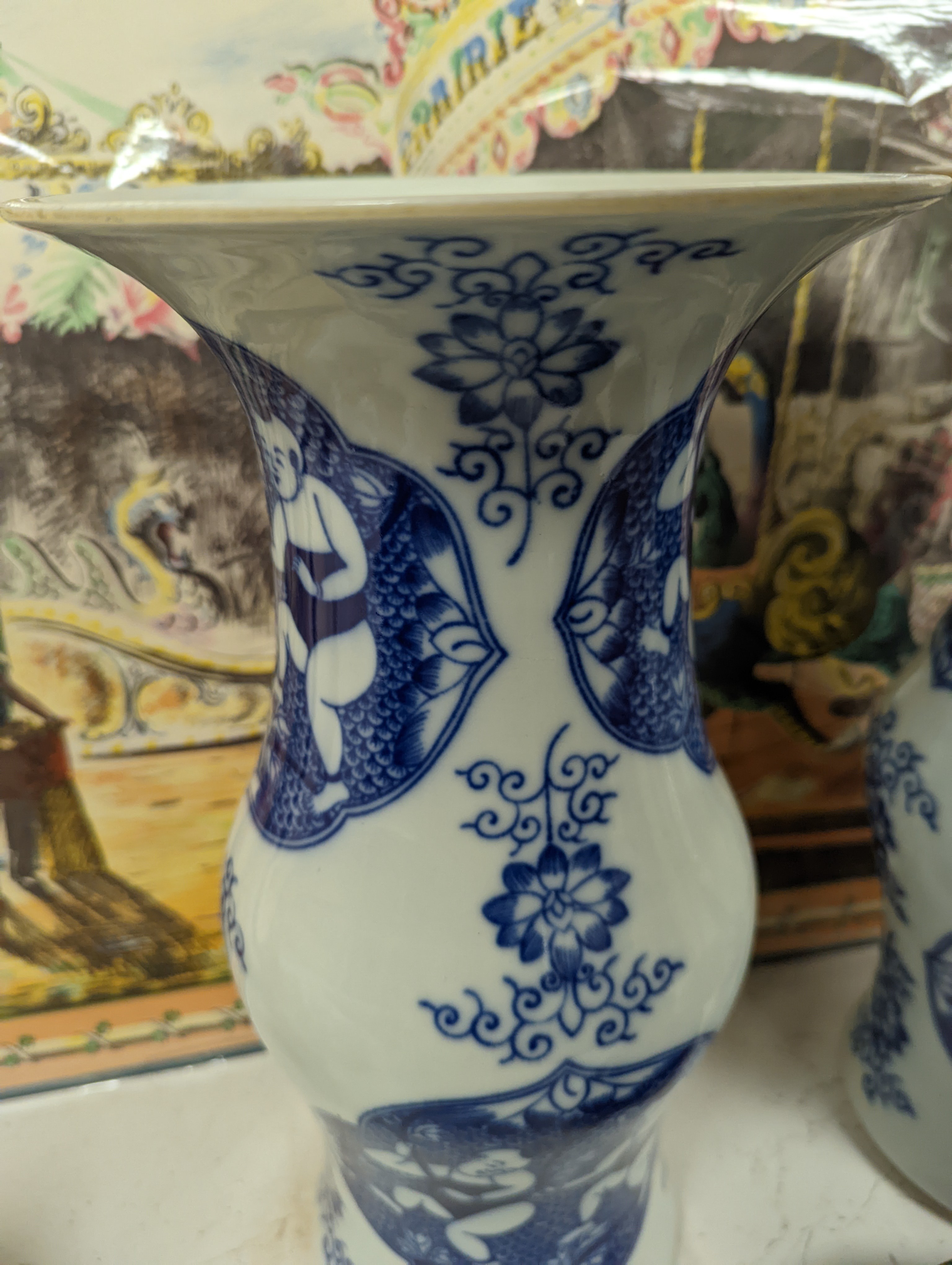 A pair of Chinese blue and white vases on stands and 6 further wood stands. Vases 35cm
